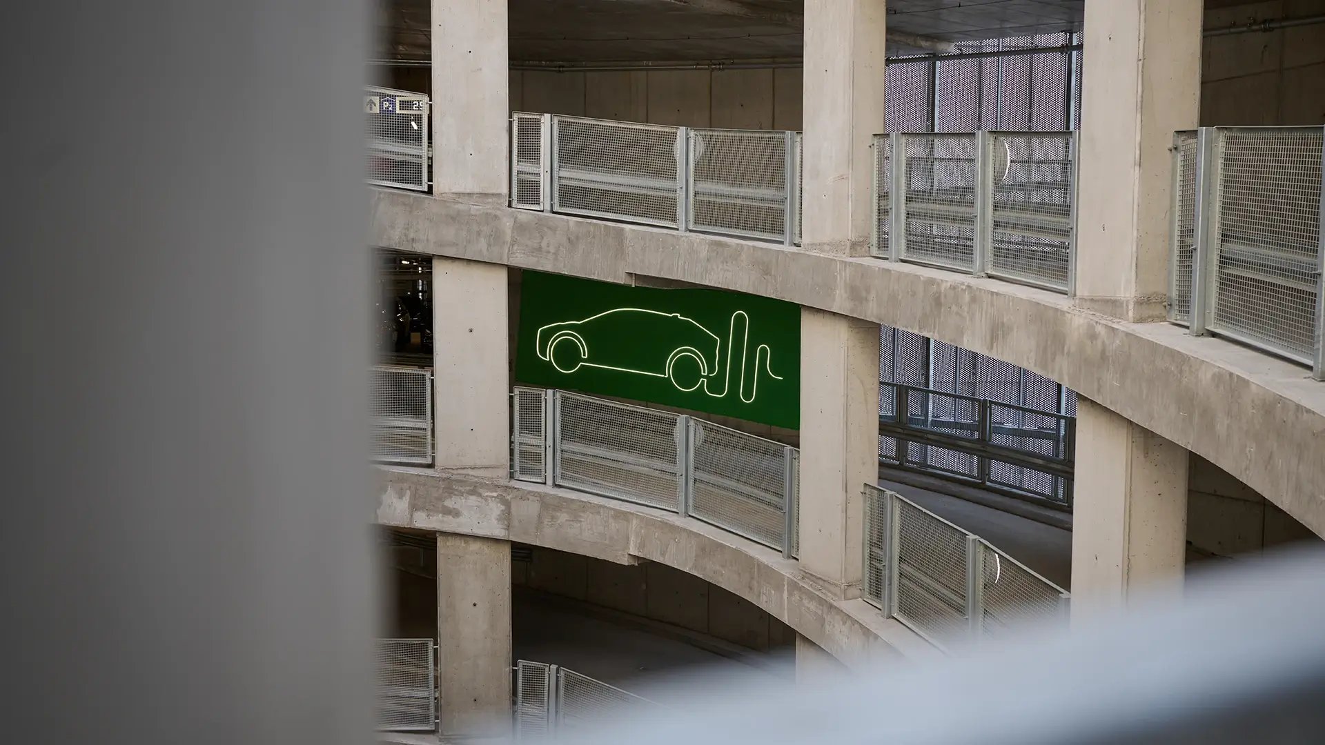 Electric vehicle charging sign parking garage