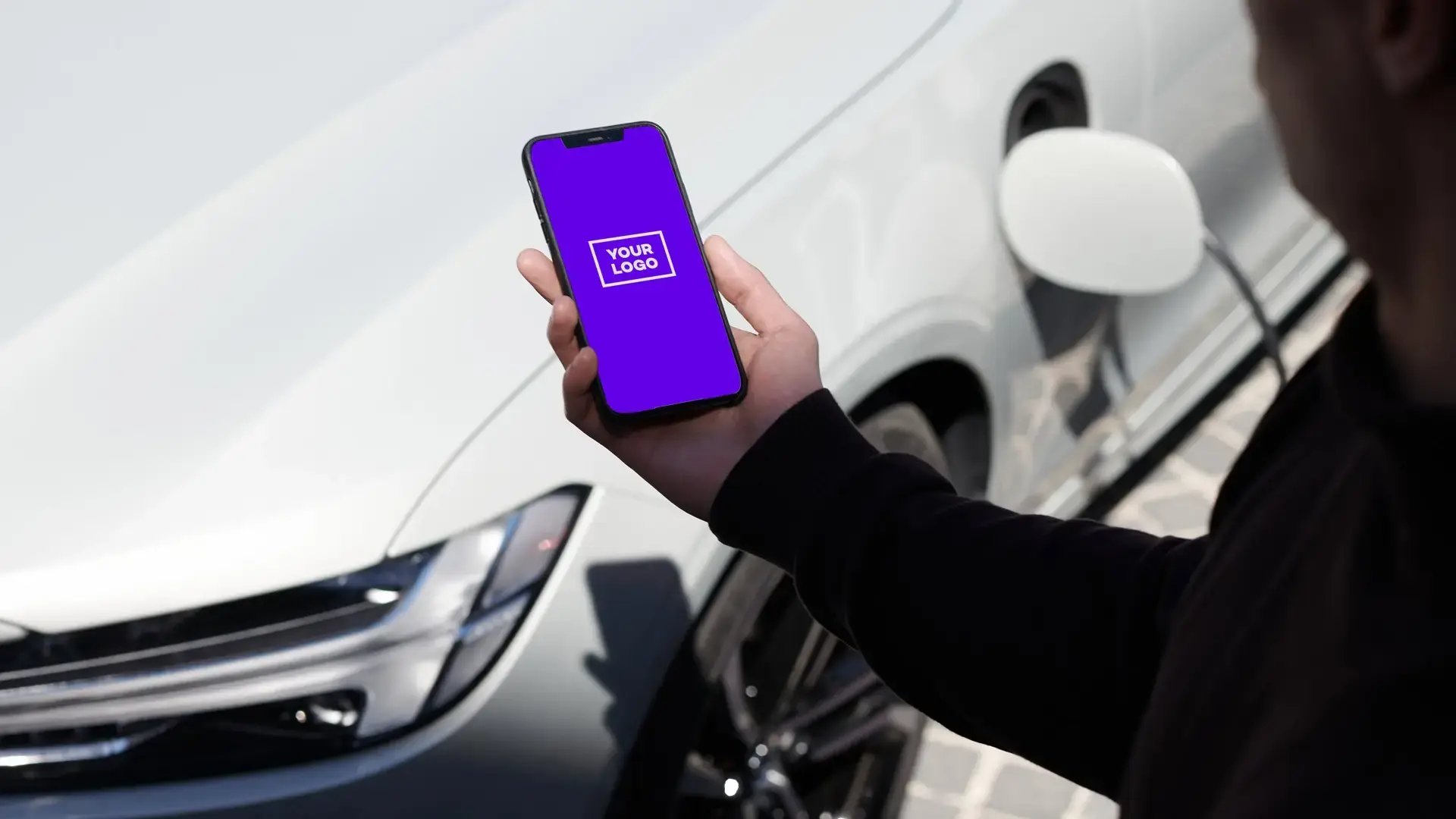 Hand holding smart phone with your logo purple screen