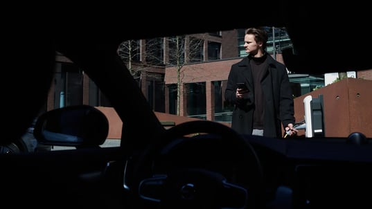 Urban electric car interior AC charging smartphone interaction