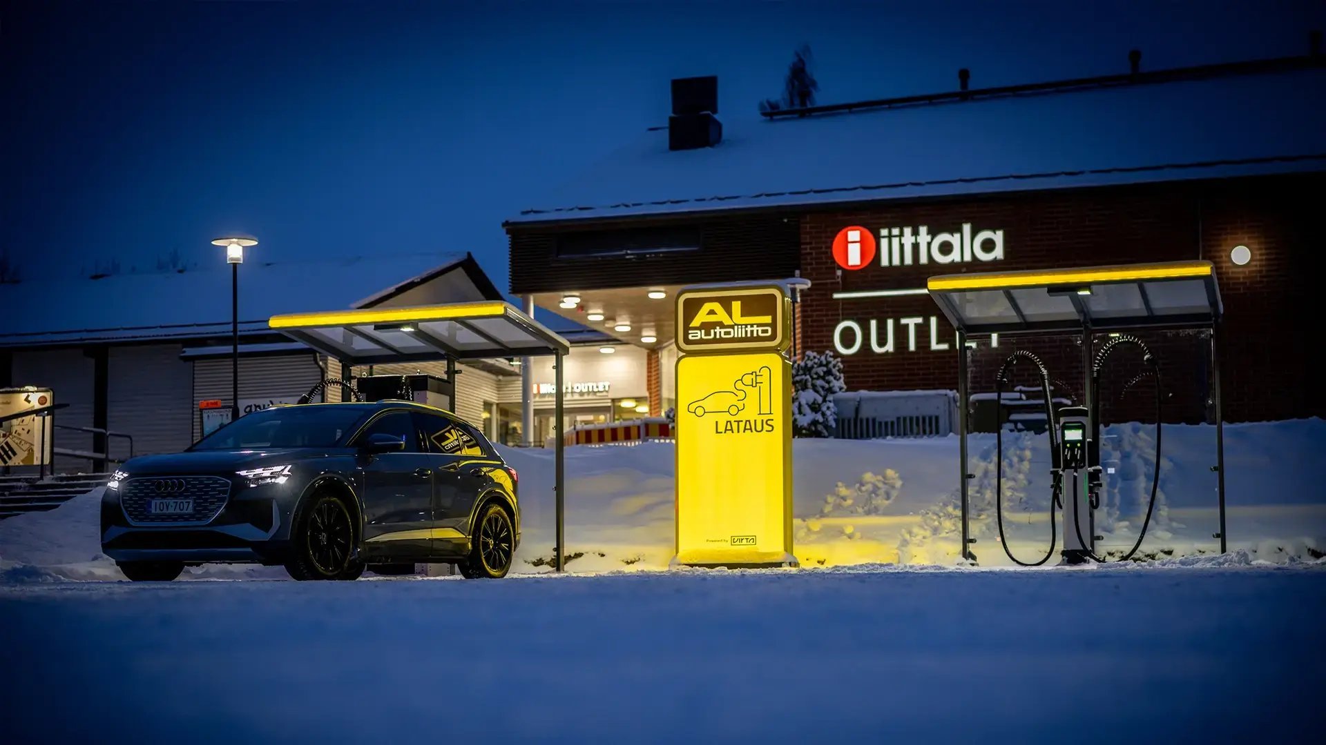 Electric vehicle fast charging outside store