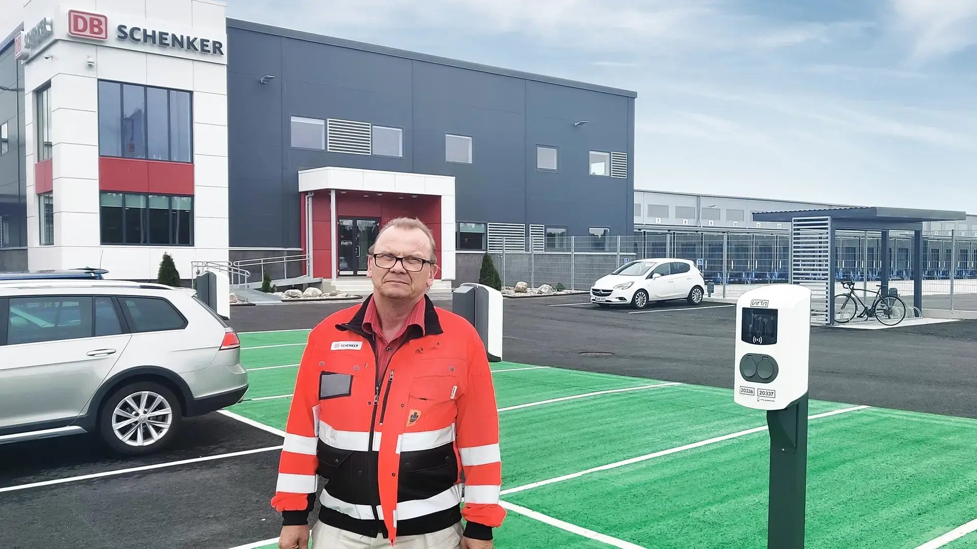 DB Schenker Arto Väisänen next to AC charger
