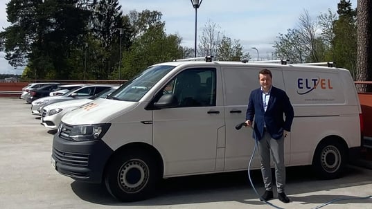 eltel-antti-saario-next-to-an-electric-van-charging-cable