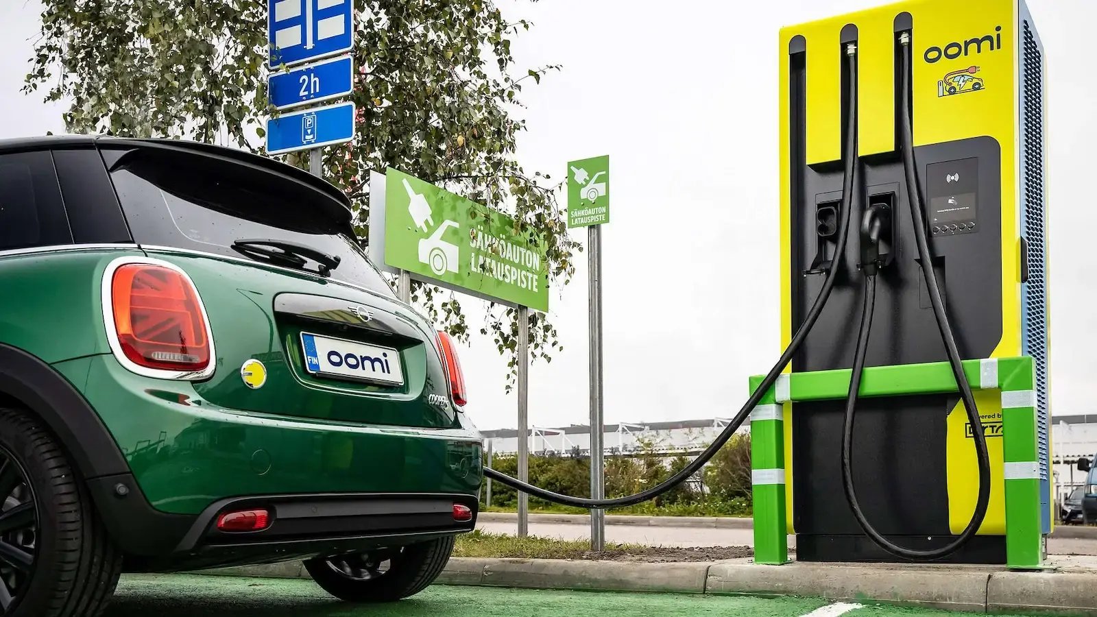 Oomi Mini EV charging at parking lot