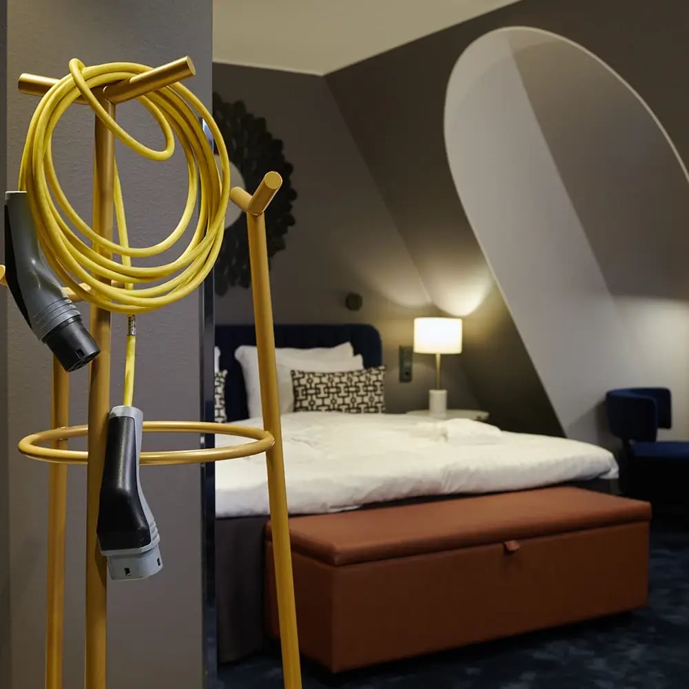 Hotel in room electric car charging amenity